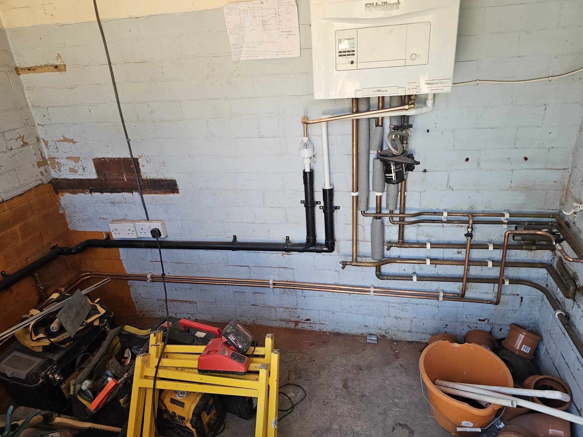 Vaillant boiler with full copper and waste pipework installation in a tight recess