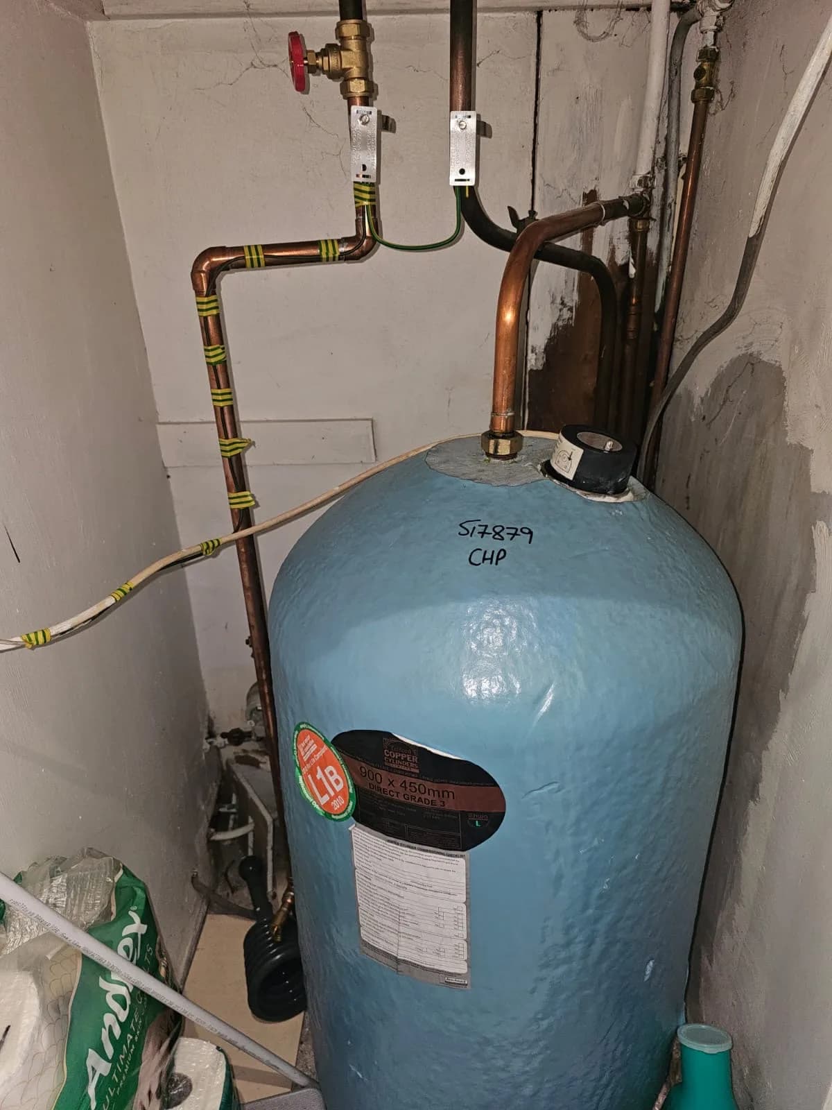 Hot-water cylinder with copper pipework and electrical earth bonding