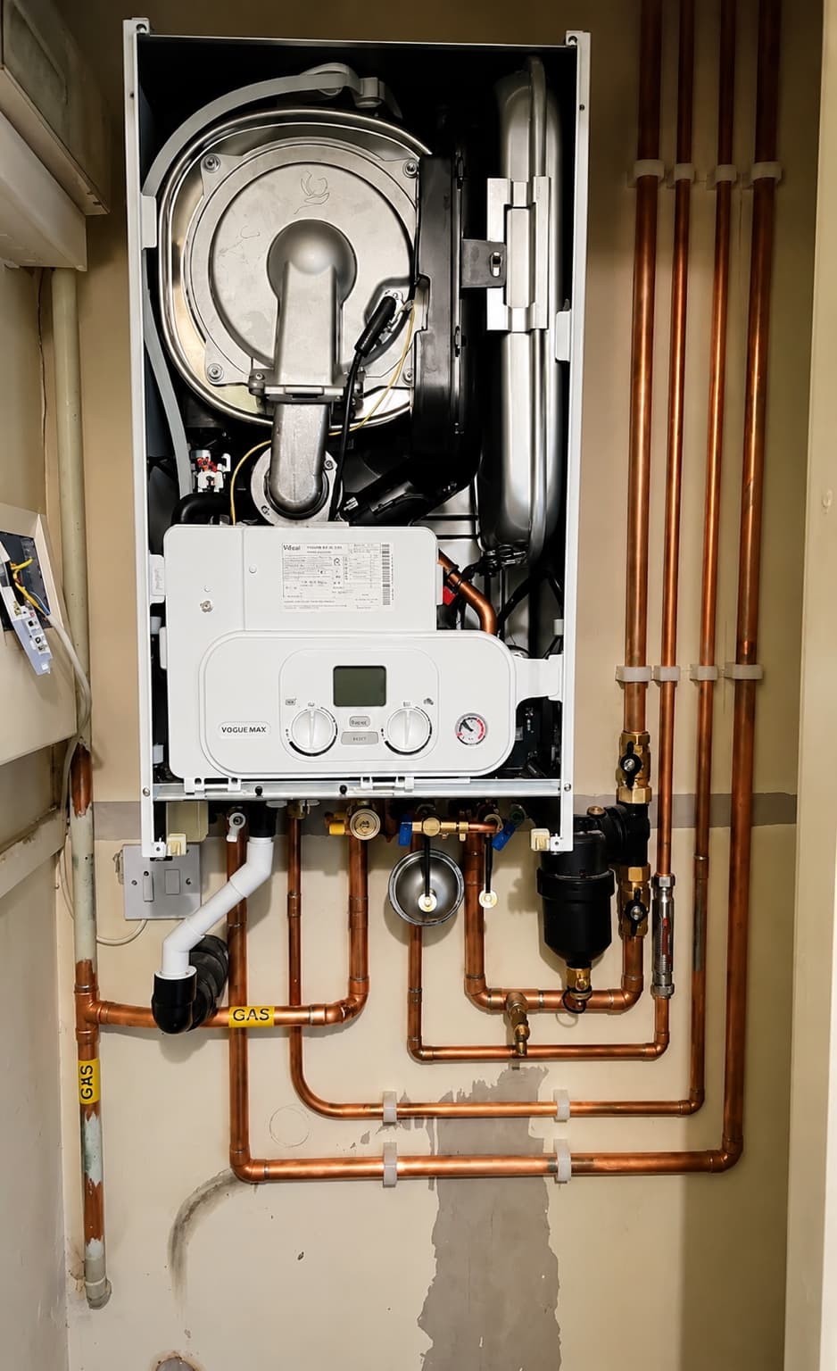 Detailed pipework and fittings inside an older property's plumbing system